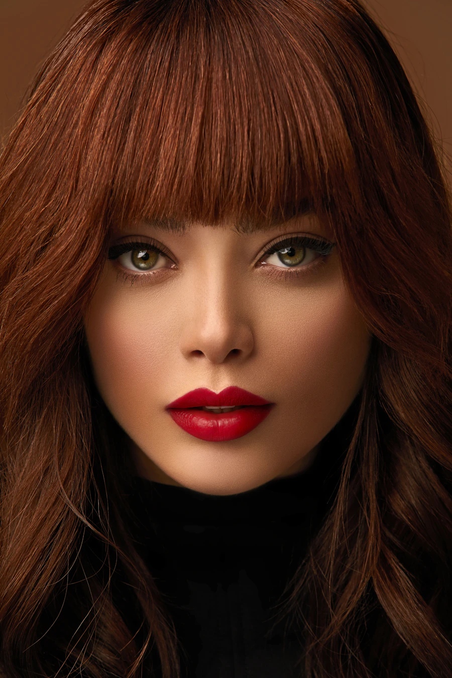 Close-up portrait of a woman with auburn hair